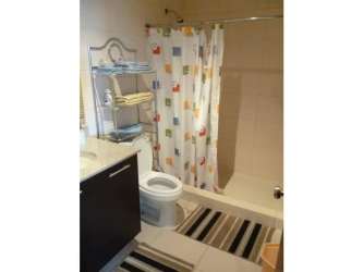 Bathroom with shower curtain striped rugs vanity Founders I Playa Blanca Panama