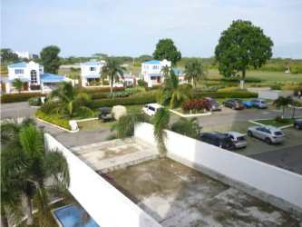 Parking lot palm trees landscaping at Founders I Playa Blanca beachfront resort Panama