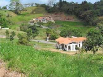 Two Mediterranean houses hillside Trinity Hills Valley mountain community Panama