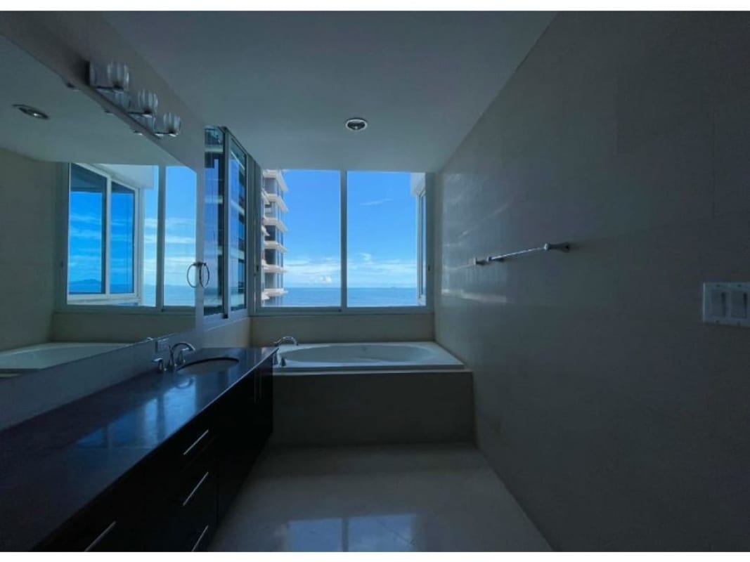 Luxury master bathroom with ocean-view bathtub and large window Punta Paitilla Panama