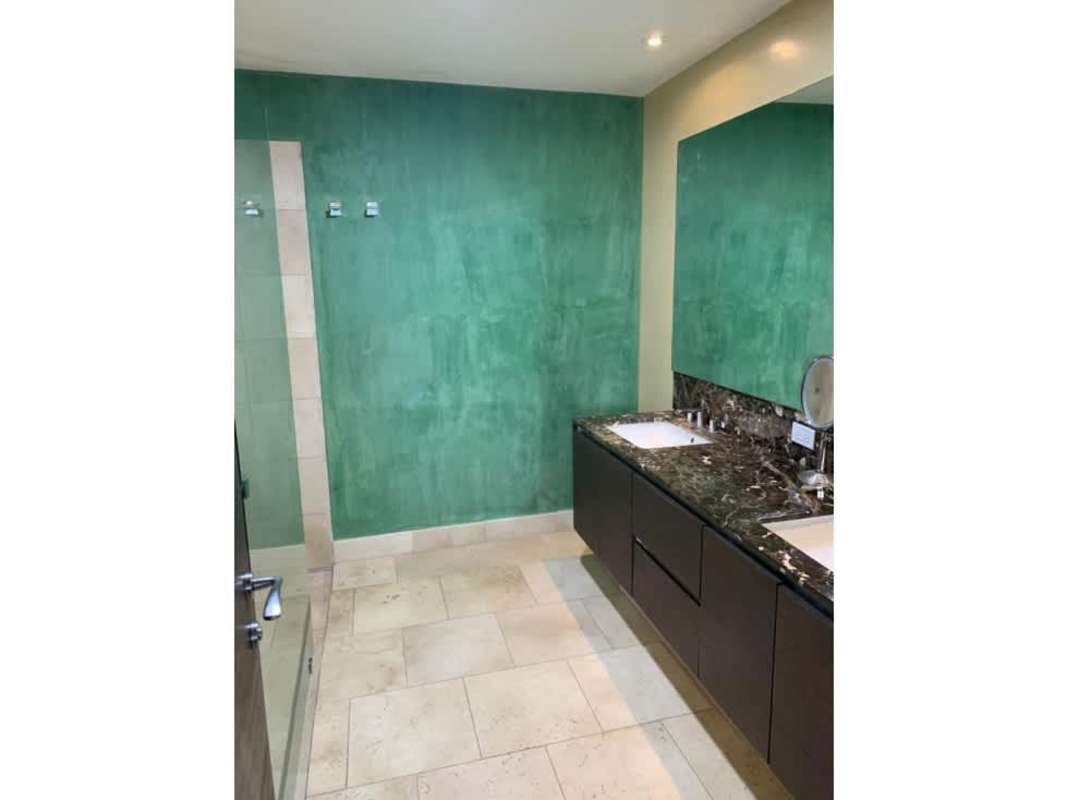 Spacious master suite with traditional four-poster bed and ocean balcony at JW Marriott Punta Pacífica Panama