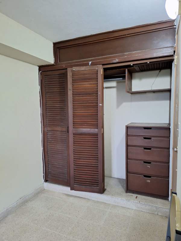 Large closet with built-in drawers and shelves in rental room El Carmen Panama City