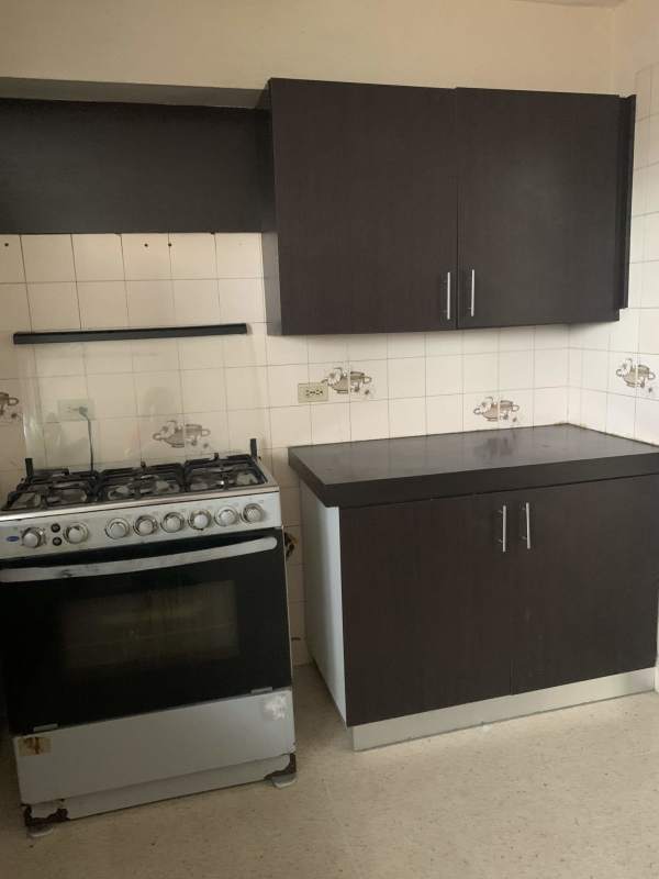 Kitchenette with gas stove top, tile backsplash, cabinets PH El Carmen 55 Panama