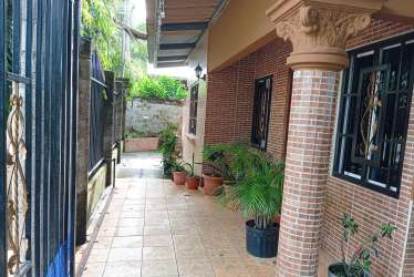 Brick façade with stone details and secure gate in Los Algarrobos Chiriquí