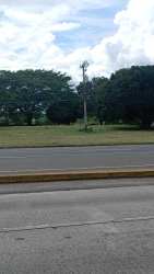 Vacant commercial lot with wide road frontage in Penonomé along Panamericana Coclé Panama
