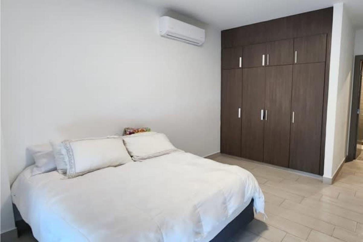 Elegant master bedroom with large windows, direct sea and city views, marble flooring Costa del Este