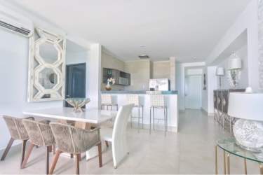Modern living room with glass doors to ocean view balcony PH Malibu Residences Panama