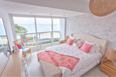 Circular beachfront infinity pool with pavilion, ocean views at PH Malibu Residences Panama