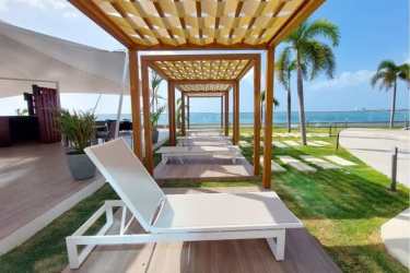 Contemporary kitchen dining space with stainless steel appliances PH Malibu Nova Gorgona Panama