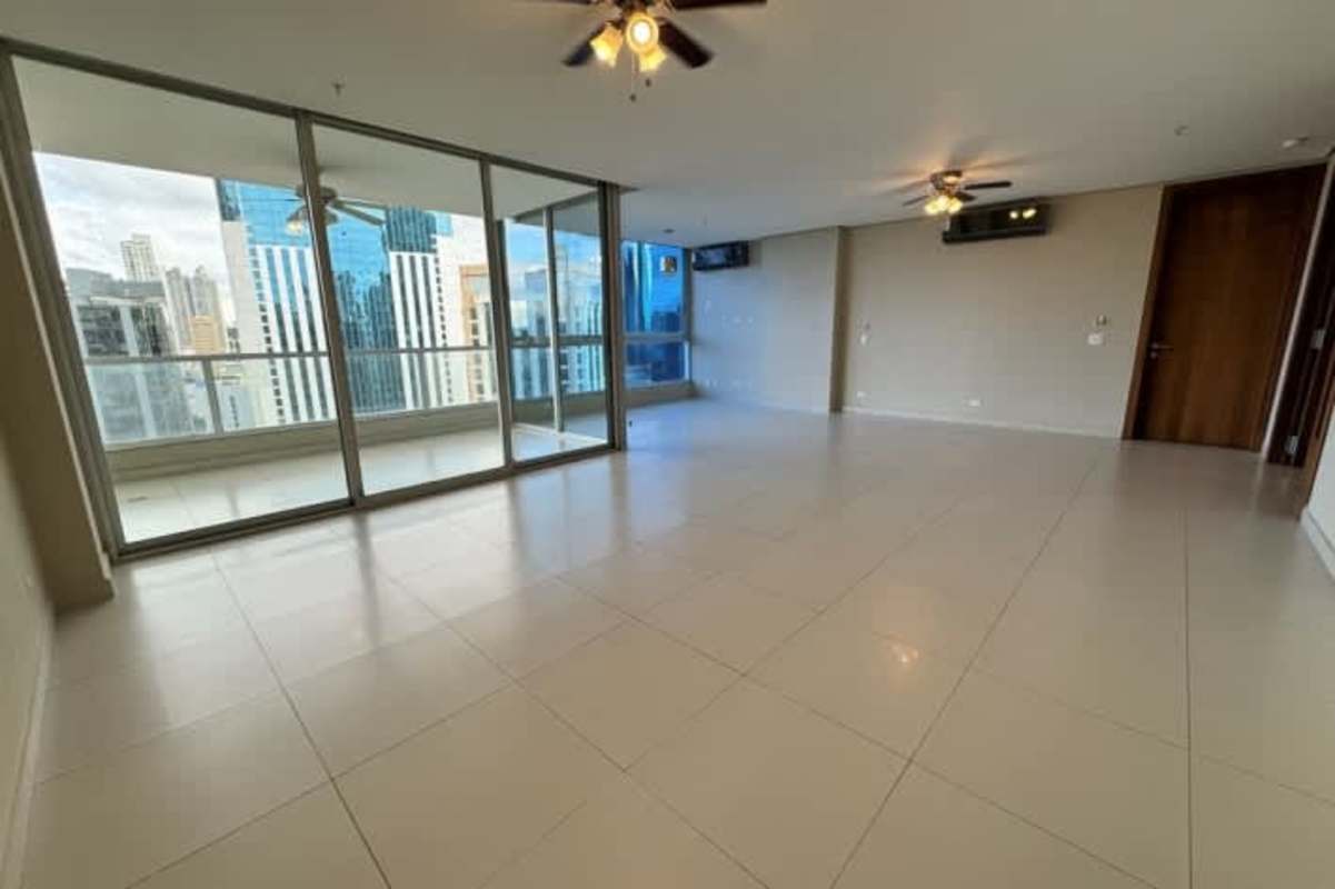 Open living space with floor-to-ceiling windows and balcony at PH Marbella Tower in Panama