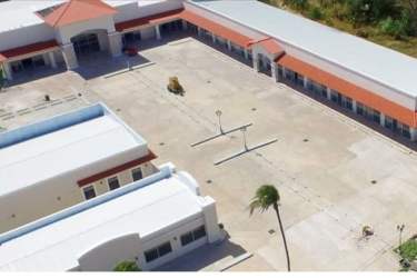 Aerial view of Mediterranean-style commercial property with red tiled roofs and central courtyard in Coclé Panama