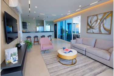 Master bedroom with sliding glass door to oceanfront terrace and sea views at Malibu Ocean Panama