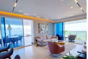 Bright living area with floor-to-ceiling windows and oceanfront balcony in PH Malibu Ocean Nueva Gorgona
