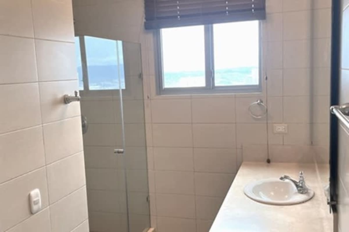 Master bedroom with scenic balcony, walk-in closet and amazing ocean views at PH Costa del Este Panama