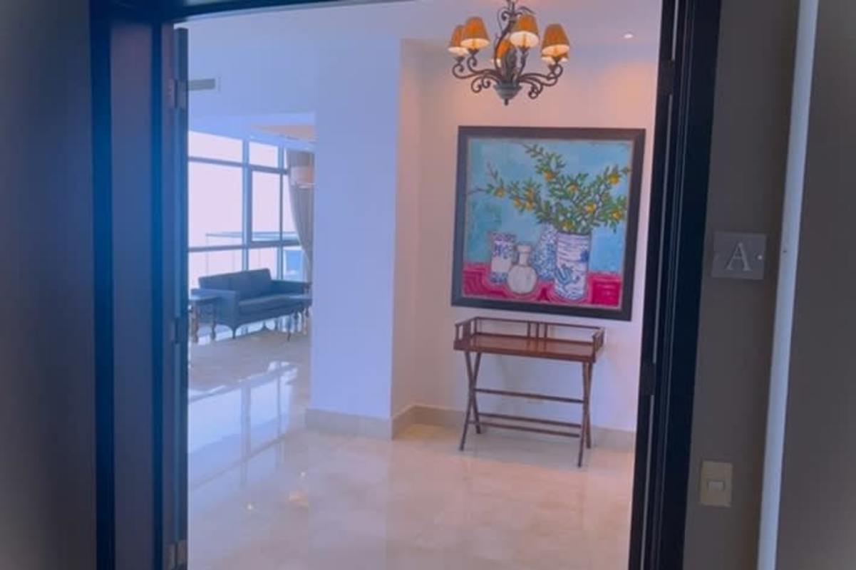 Marble lobby with seating and concierge at PH Costa del Este Prime Tower Panama City