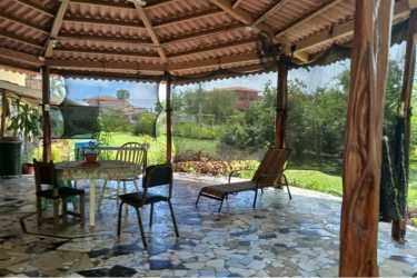 Private balcony of upstairs apartment overlooking green yard Nueva Gorgona