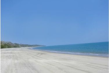 Scenic sunset over calm Pacific Ocean seen from beachfront land Bijao Panama