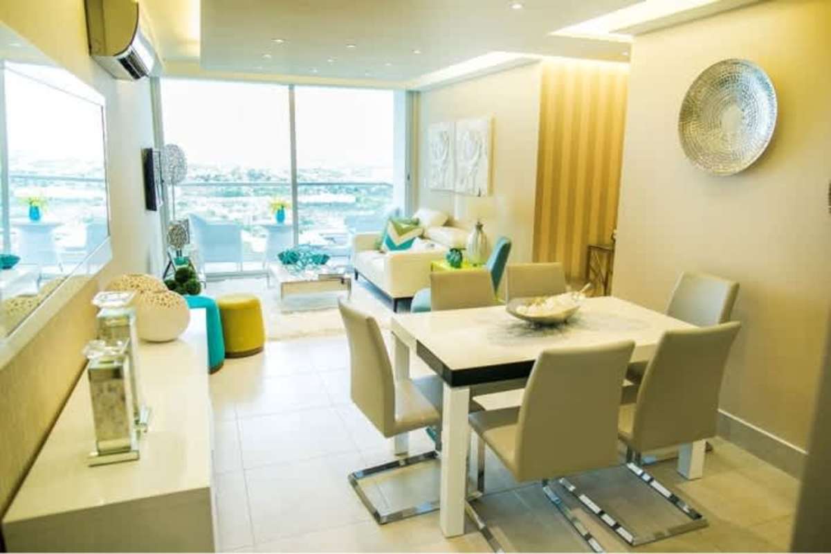 Open concept living dining area with balcony at PH Metropolis Panama City