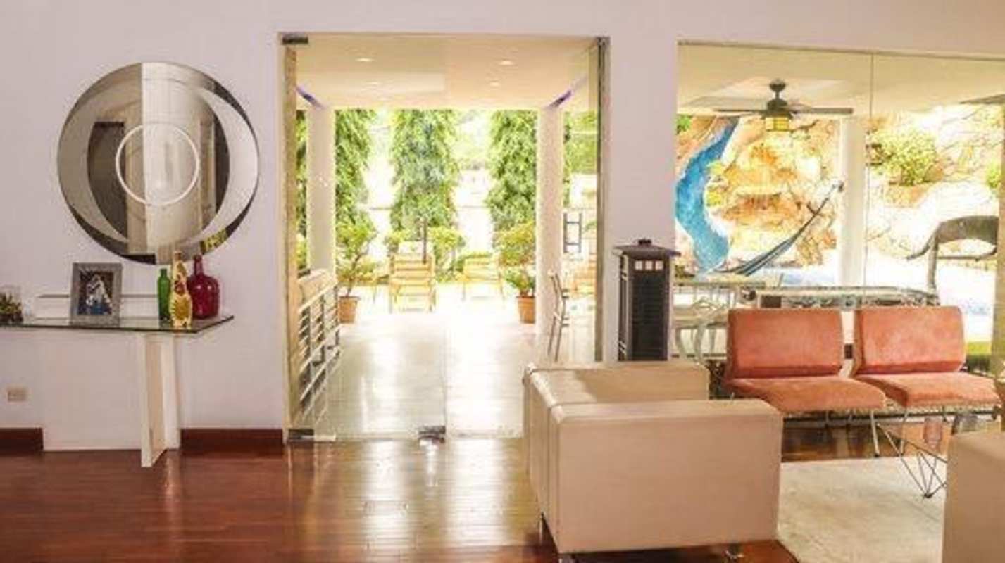 Bright living room opening to terrace and backyard pool in Condado del Rey