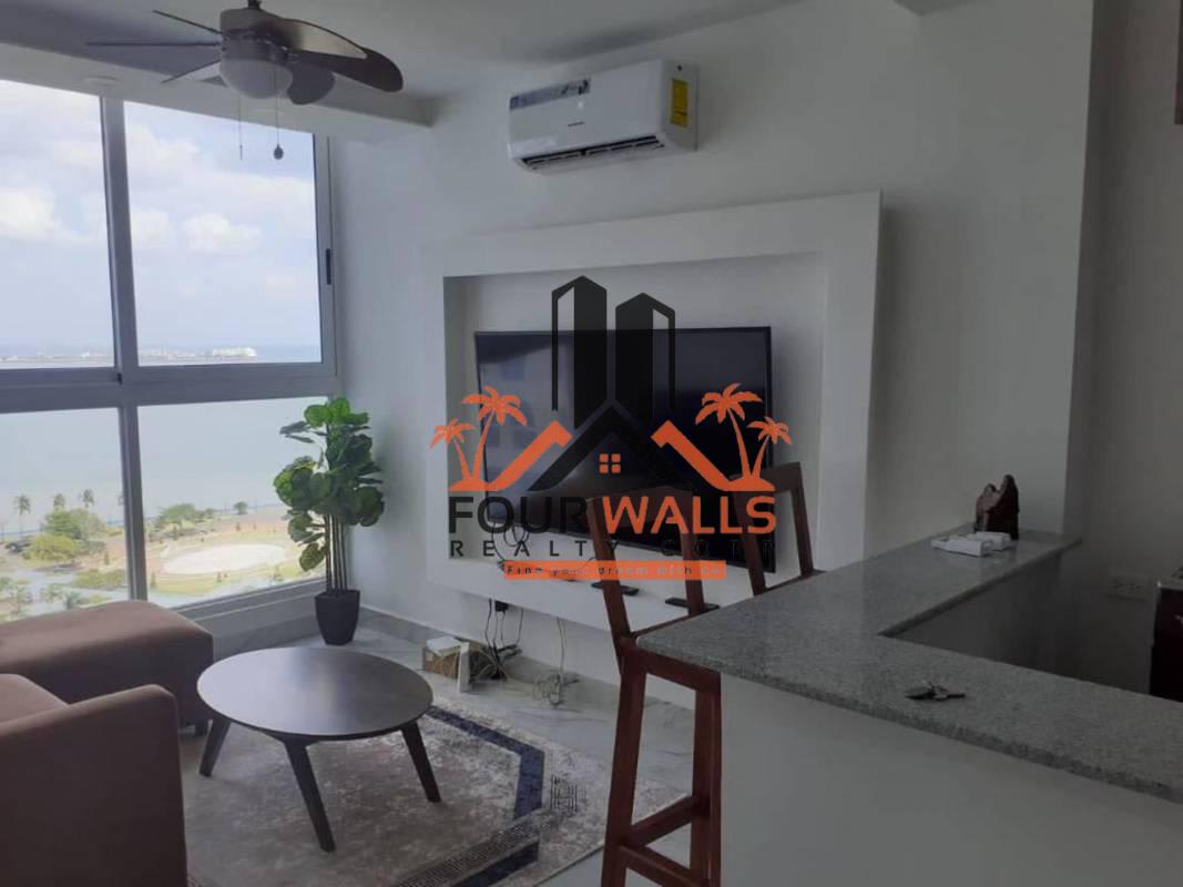 Kitchen with L-shaped granite counters and gas stove in PH The Sands Avenida Balboa Panama City