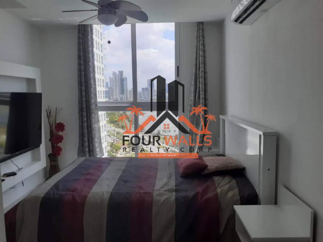 Bright bedroom with AC, large window city views, wall-mounted TV in PH The Sands Panama