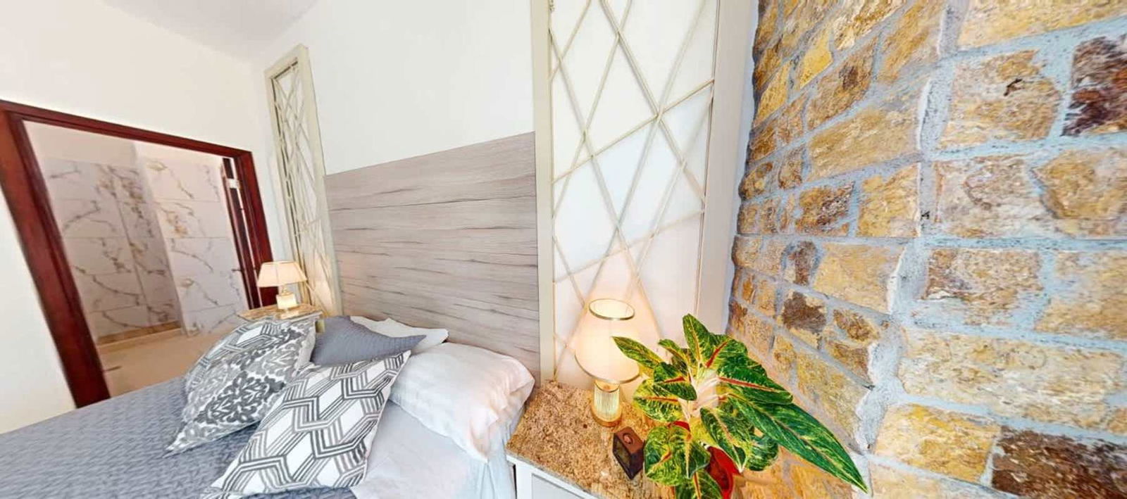 Contemporary bedroom with walk-in closet, marble floors, terrace view in PH Amador Hills Panama