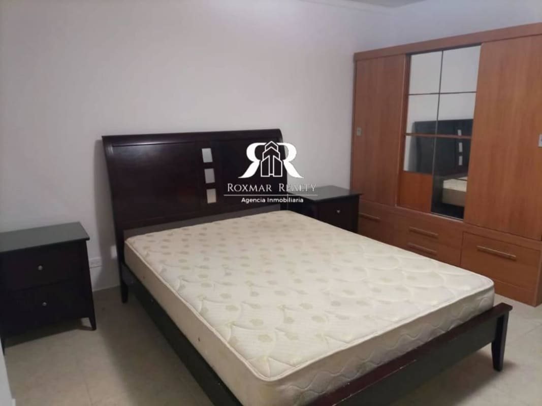 Bedroom with large window, blinds, bed frame in PH Blue Park Panama