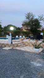 Private pool stone steps garden lounger area Malibu Gorgona residential beach home Panama