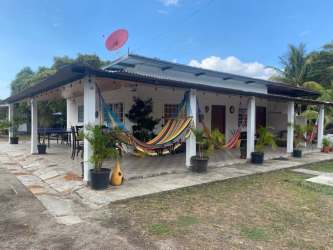 Small tropical bungalow with hammocks porch covered patio Gorgona Panama beach house rental