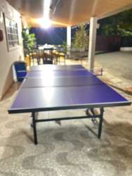 Covered outdoor patio with ping pong table and dining area at rental beach villa Gorgona Panama
