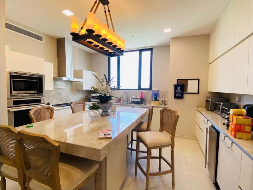 Modern luxury kitchen with marble island, top appliances, panoramic window Santa María Court Panama
