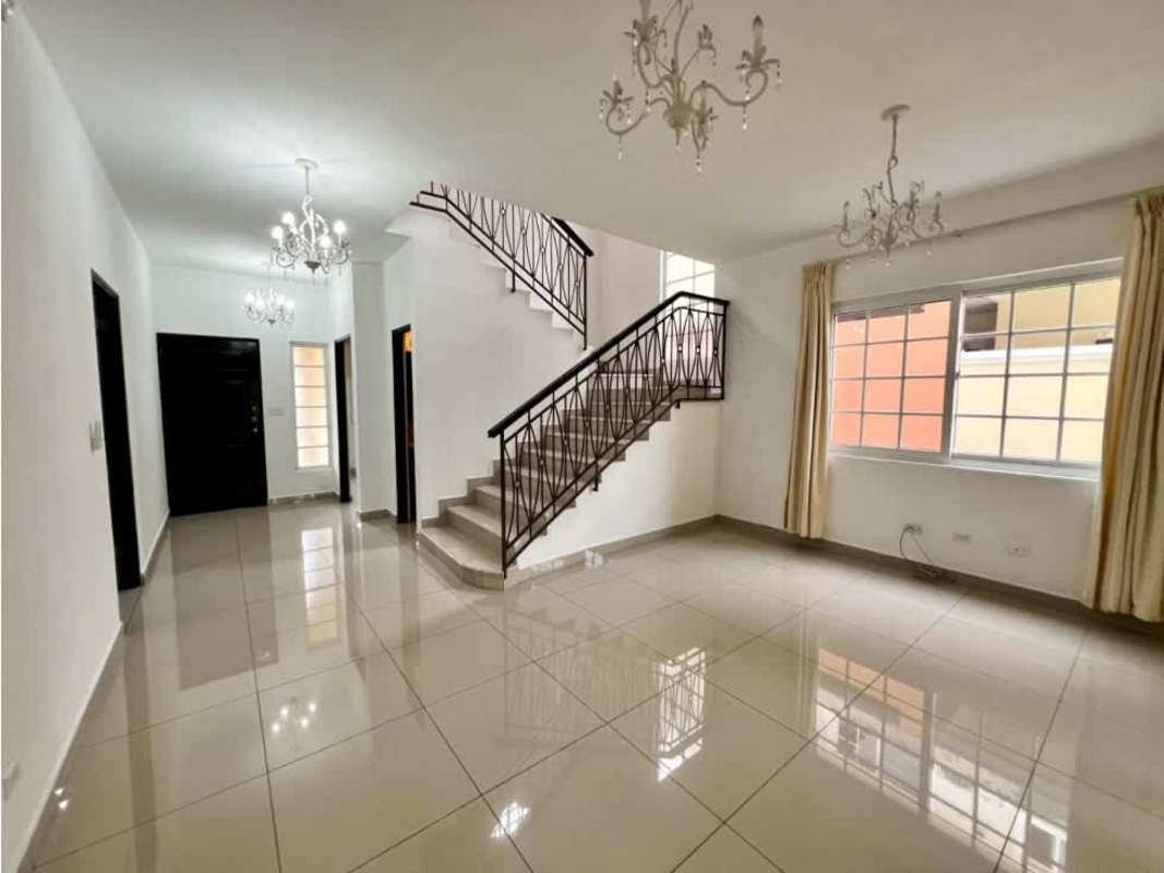 Contemporary bedroom with tiled floor, split AC, ceiling fan, and large window in Villa Valencia Costa Sur Panama