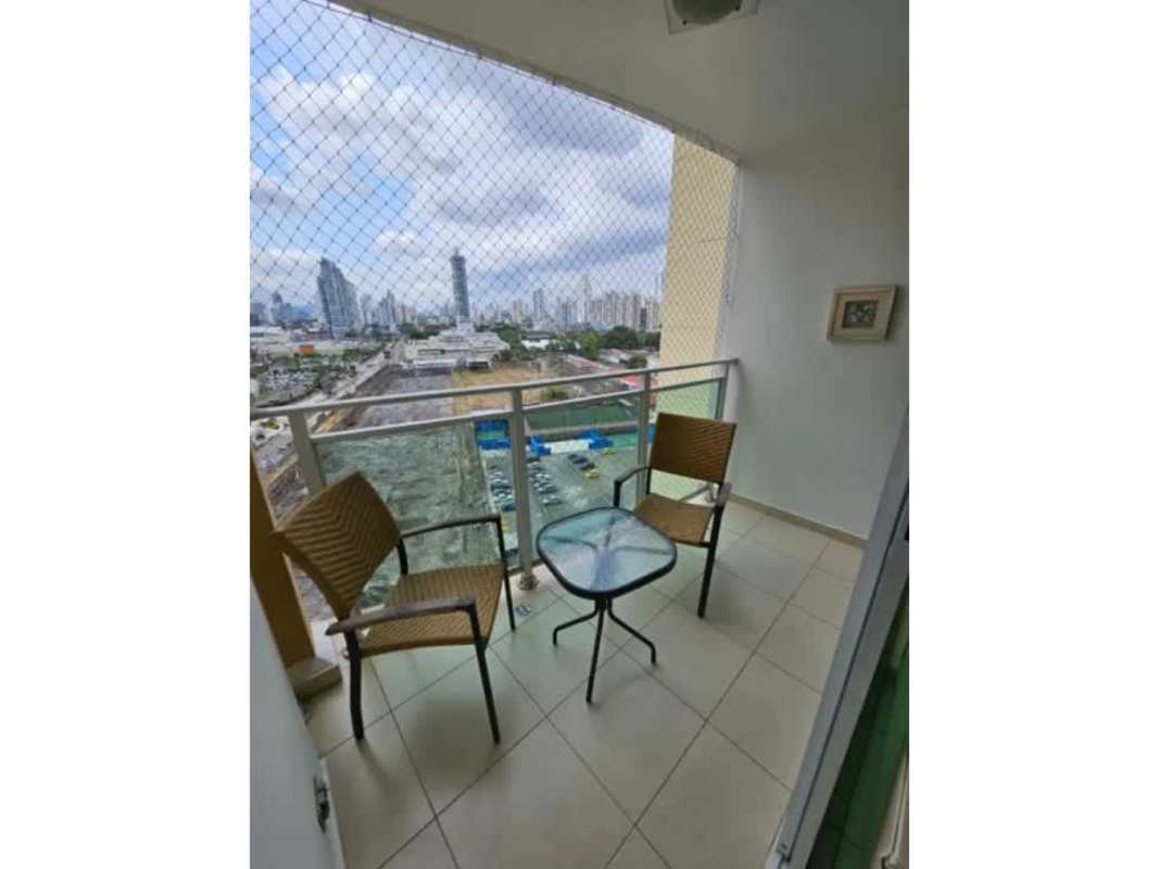 Balcony with seating area enclosed by safety net overlooking Panama skyline in PH Royal Pacific Punta Pacifica