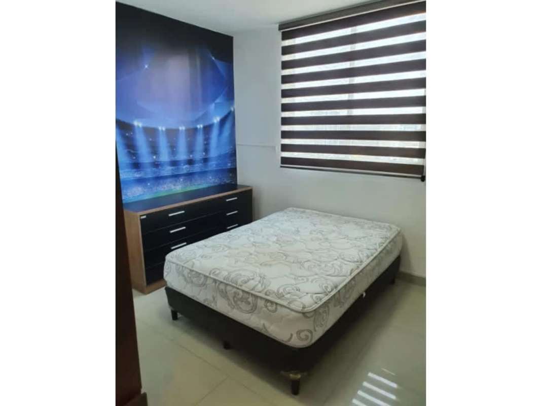 Bedroom with modern decor, large window with blinds, stadium themed wallpaper in PH Diamond Tower Panama City