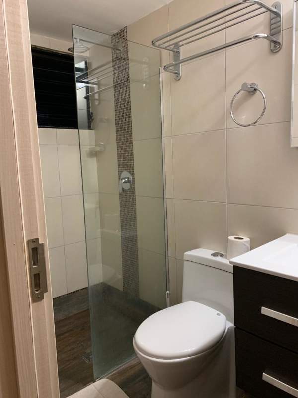 Modern bathroom ceramic tile glass shower enclosure PH San Francisco Bay Tower Panama City