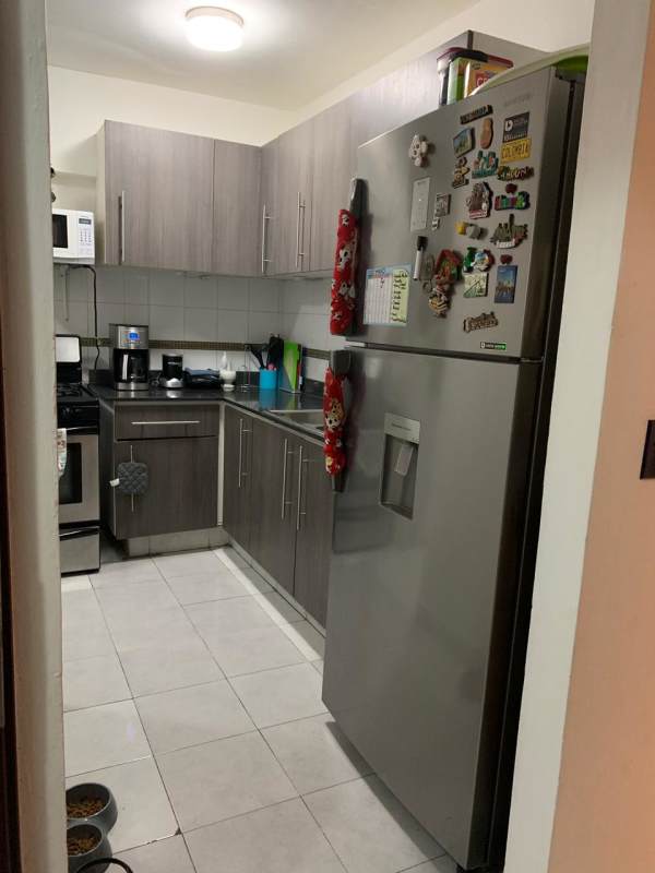 Equipped kitchen with tile backsplash, gas stove, microwave refrigerator PH San Francisco Bay Tower Panama