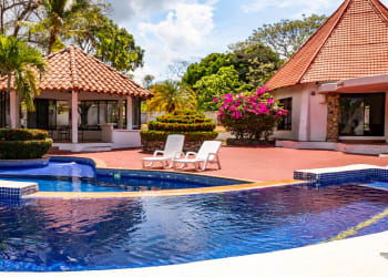 Gorgeous villa exterior with pool lush gardens perfect Panama tropical rental