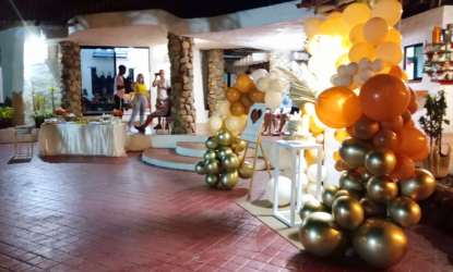 Patio with stone columns balloons decor event ready at beachfront villa Gorgona