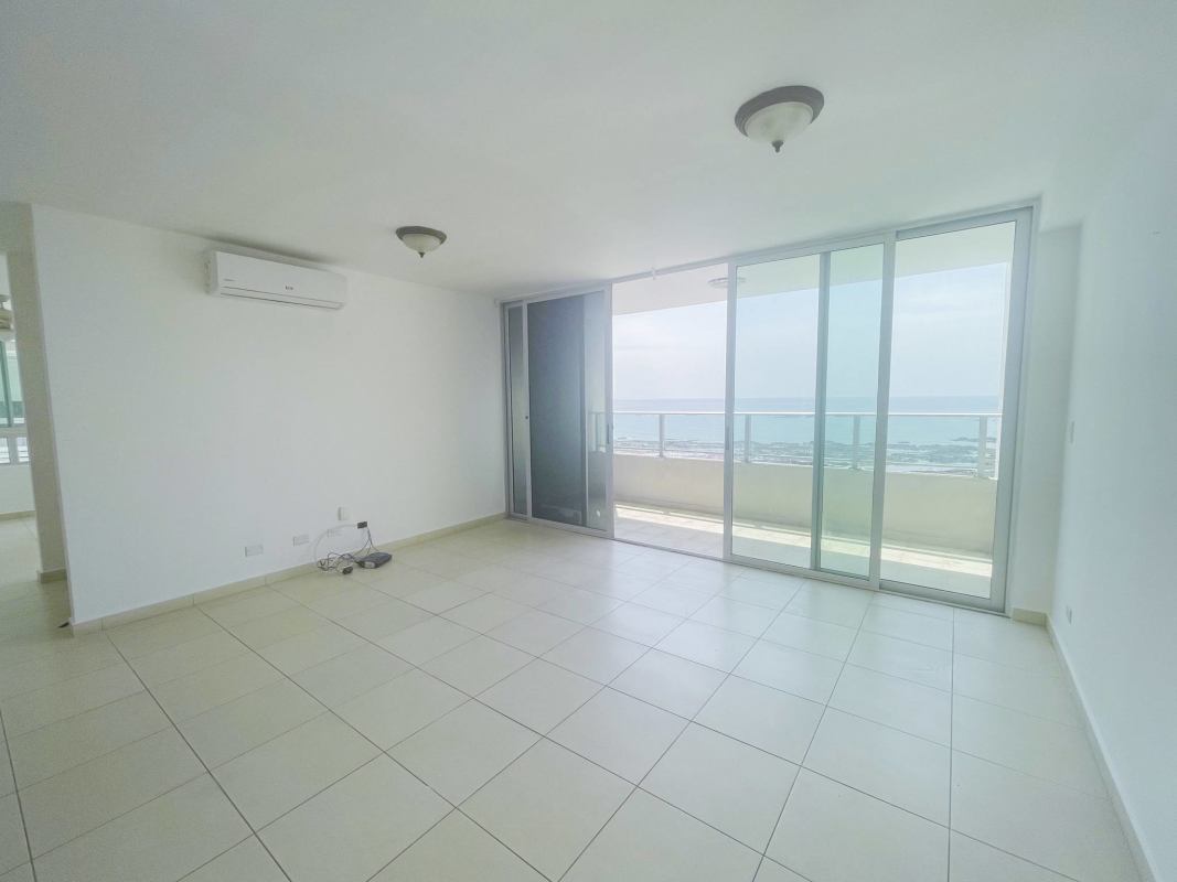 Infinity swimming pool with lounge deck facing ocean at PH Terrasol San Francisco Panama City