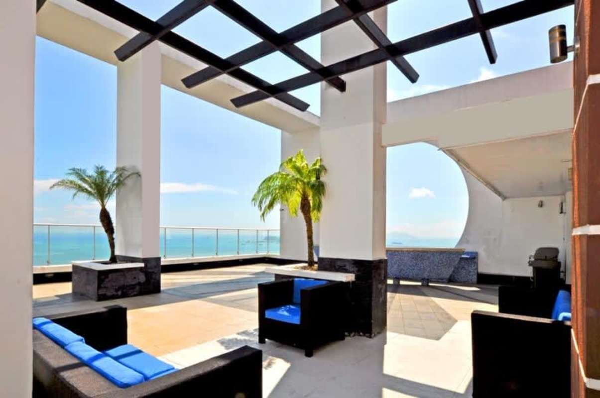 Luxurious rooftop pool area with ocean and city skyline view in Renaissance Tower Panama