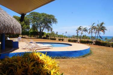Coastal villa with thatched palapa and swimming pool on oceanfront estate Pedasi Panama