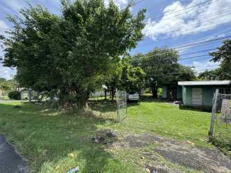 Roadside commercial development lot with fence line and access Panamericana Highway in Panama