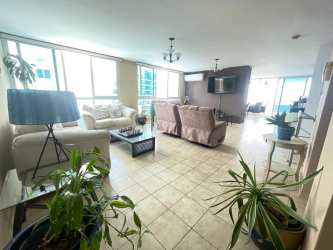 High-rise condo tower next to sandy beach and Pacific sunset at Playa Serena Gorgona Panama