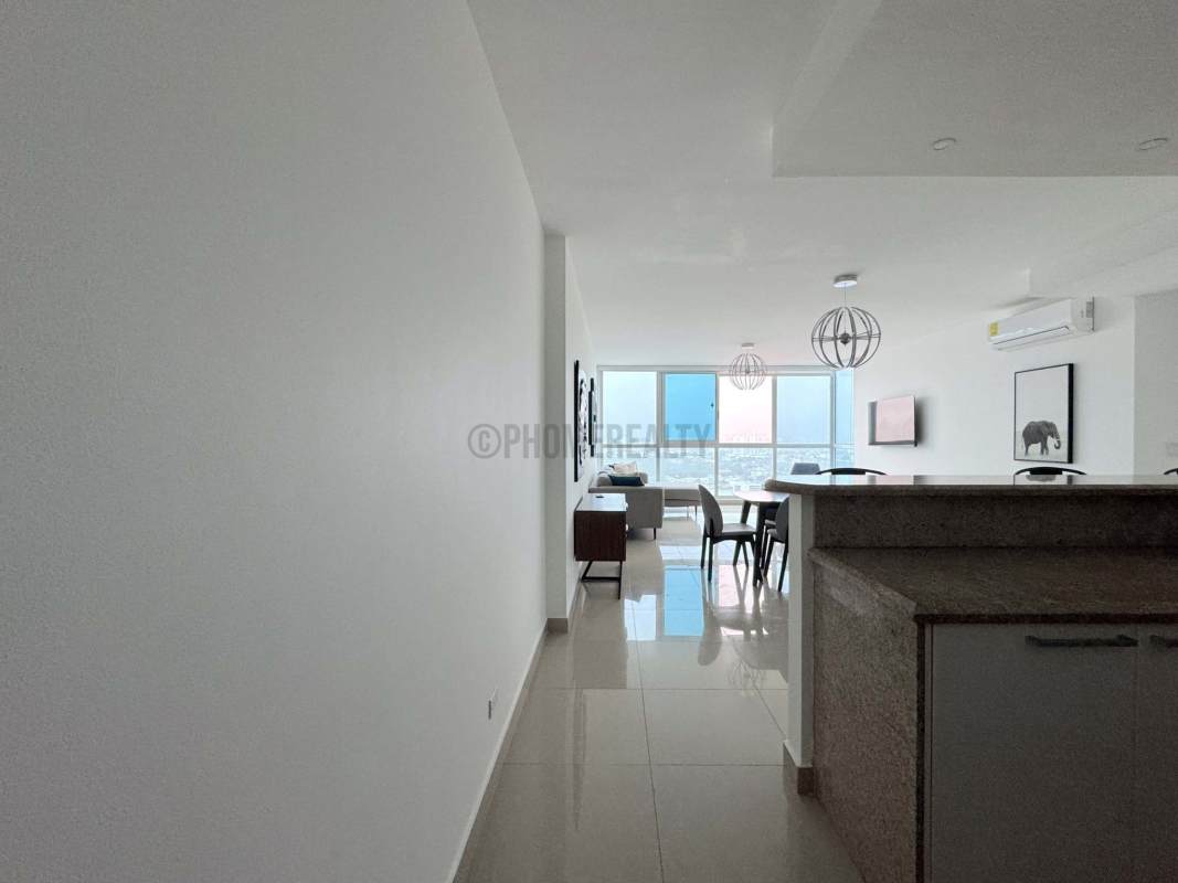 Modern kitchen with granite countertops and breakfast bar in PH Costa del Este Panama