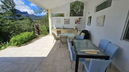 Bright kitchen with granite countertops, stainless appliances, mountain view window at Sienna Altos del María Panama