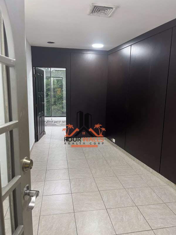 Hallway with tile floor, glass block accents, commercial office for rent San Francisco Panama