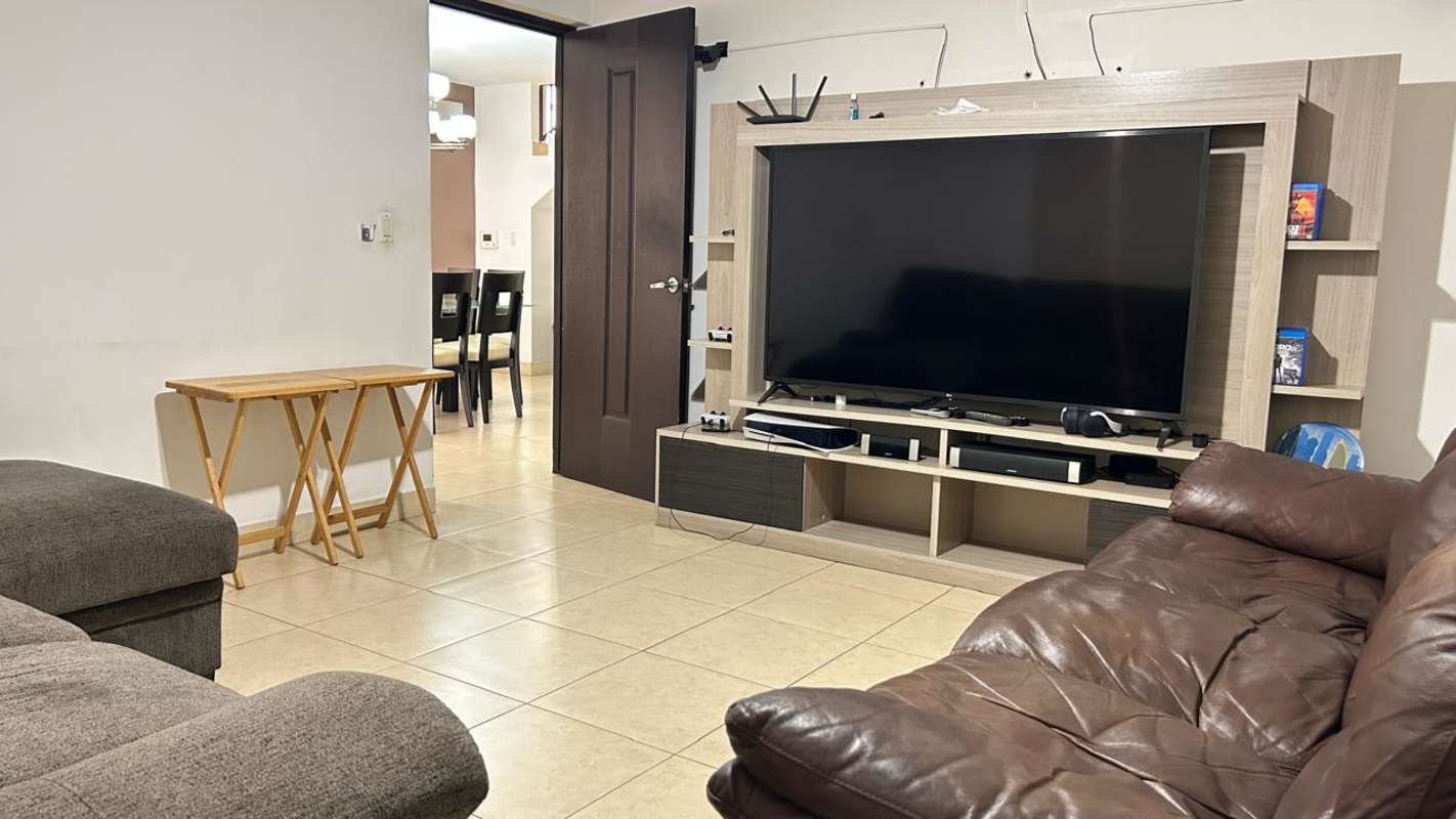 Modern bathroom with granite vanity and glass enclosure in Condado del Rey Panama