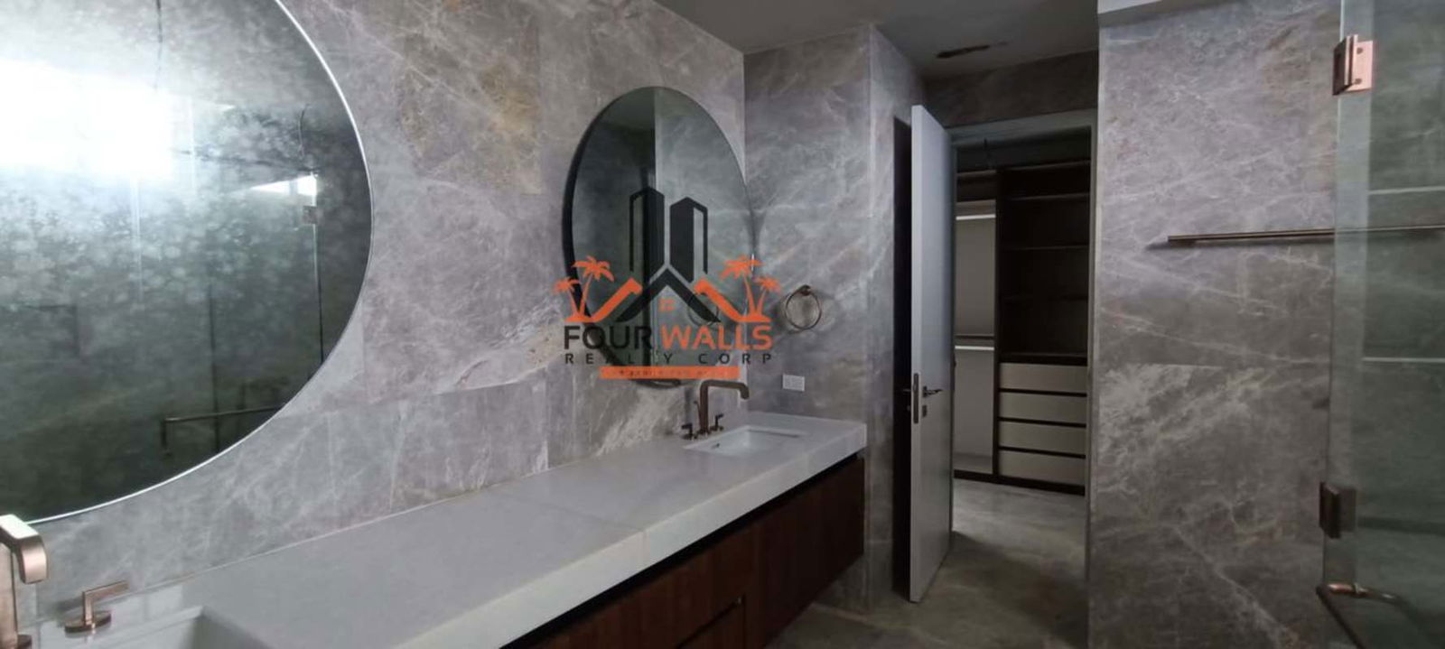 Modern living room with marble floors and giant windows with Pacific Ocean view in PH The Towers Punta Paitilla