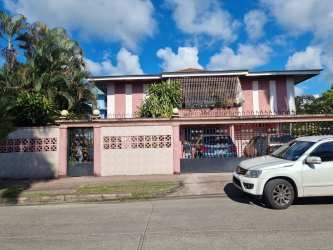 Bright interior space tiled floor windows metal security bars Margarita Colón Panama