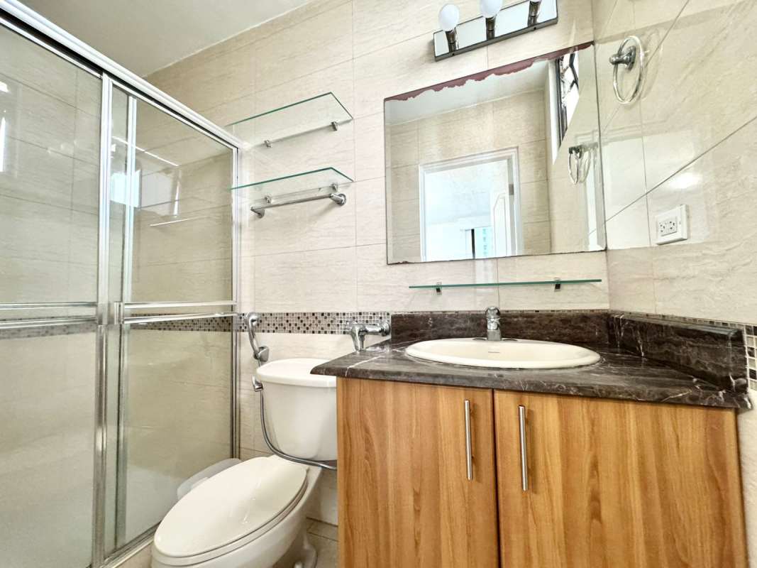 Bedroom with large window, closet, tiled floor in PH San Francisco Bay Panama